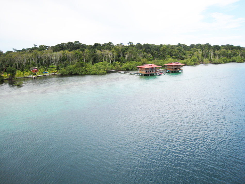 Two large houses on the water.